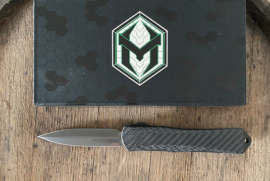 Heretic Knives manticore X hand ground stonewashed dlc blade with carbon fiber & flamed Titanium chassis S/N:016