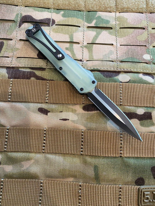 HERETIC MANTICORE-S OTF AUTO DOUBLE EDGE JADE G-10 CHASSIS BOTTOM WITH TWO TONE BLACK BLADE